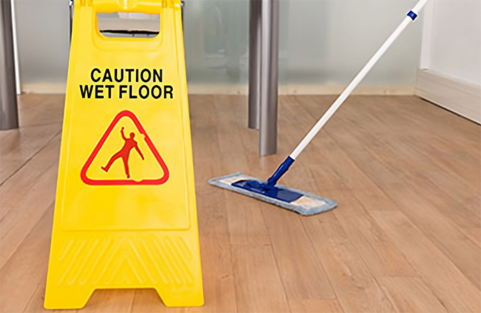 wet floor sign and mop