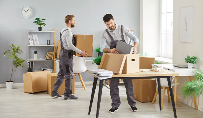 Cleaners clearing an office to make it move-in ready.