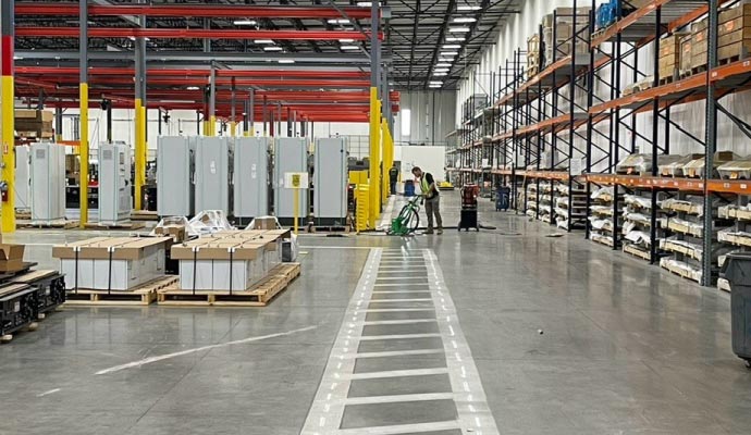 A spacious and organized industrial warehouse cleaning service