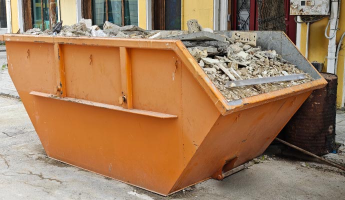 Concrete debris inside construction dumpster