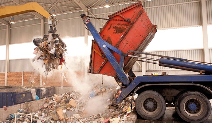 Truck unloading waste for disposal