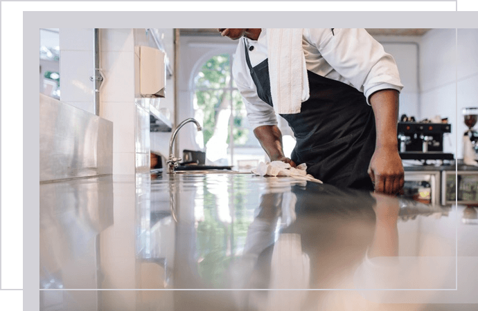 Keeping your restaurant kitchen cleaning and chef cooking food