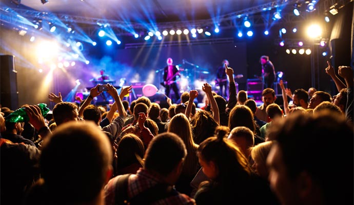 Live music concert with crowd and stage lighting