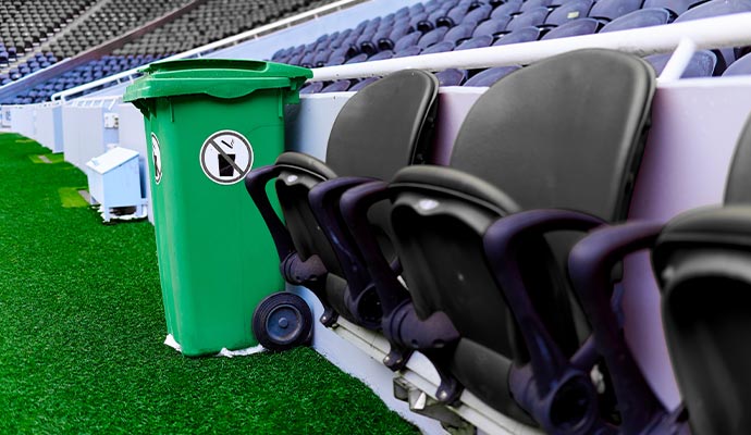 Stadium seating beside wastebin