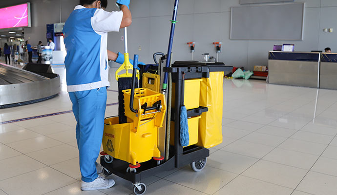 woman cleaning airport with janitorial